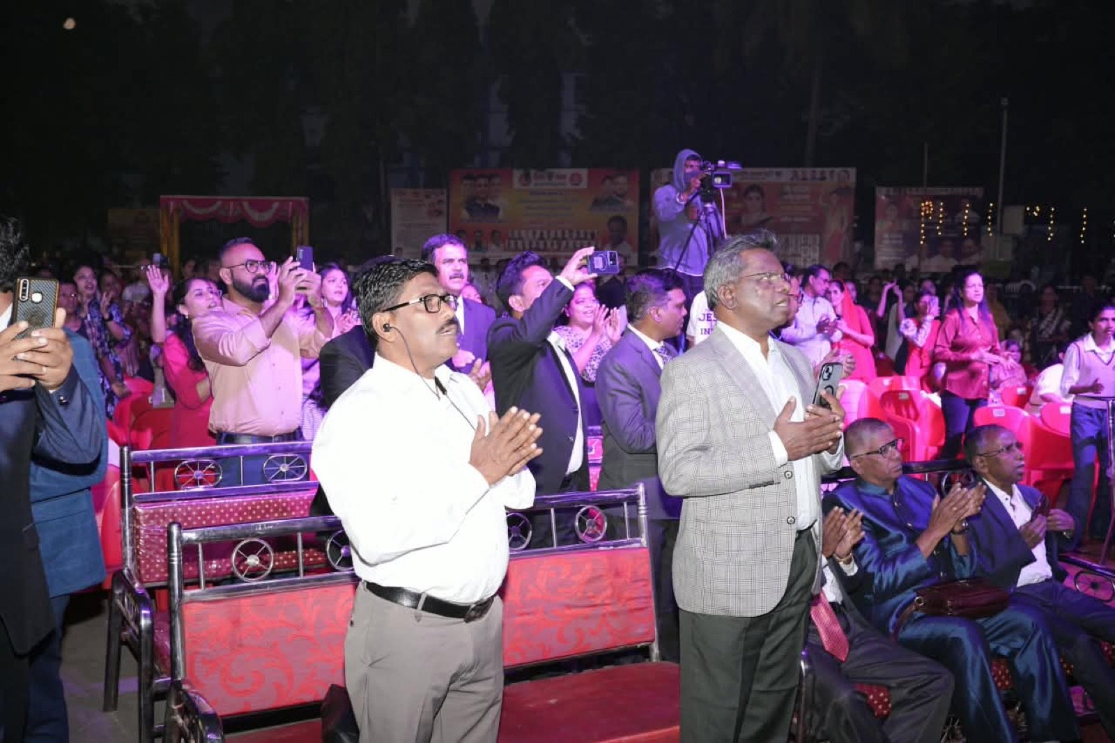 Pastors praying on stage